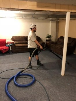 Carpet Luster Inc worker cleaning a carpet